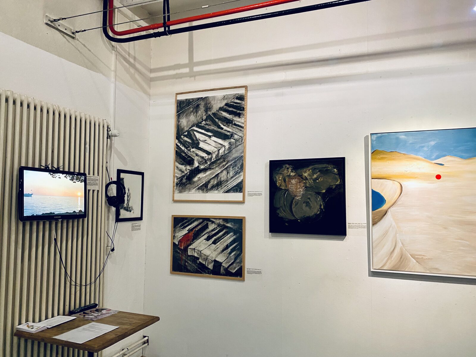 Gallery view showing Nous sommes tous poussière d'étoiles installed alongside other artists' work.